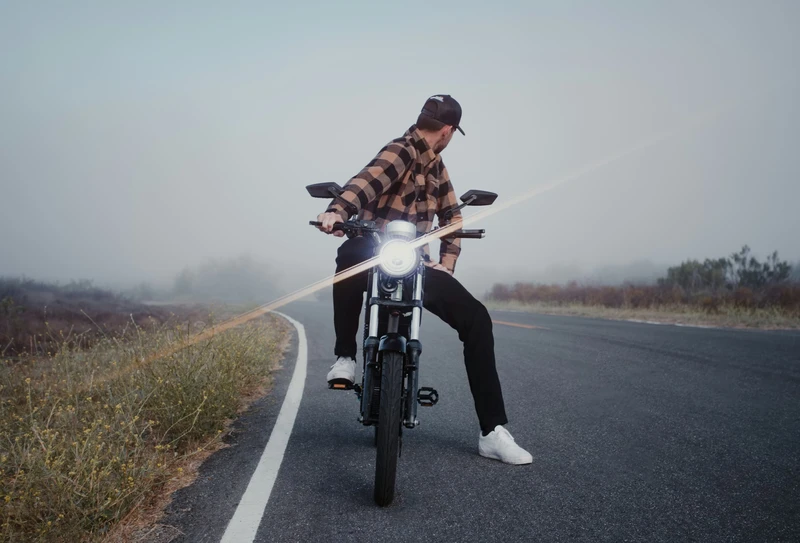 Electric motorcycle-style vehicle with pedals added